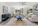 Cozy living room boasts a ceiling fan and natural lighting at 3824 W Puget Ave, Phoenix, AZ 85051