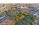 Aerial view of the community with well-maintained roads, parks and a nearby school at 4187 N 298Th Ln, Buckeye, AZ 85396