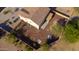 Aerial view of a spacious backyard featuring desert landscaping, a covered patio, and a fire pit at 4187 N 298Th Ln, Buckeye, AZ 85396