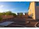 Expansive backyard with desert landscaping, a block wall fence, and a concrete slab at 4187 N 298Th Ln, Buckeye, AZ 85396