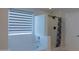 Bright bathroom showcasing a tub and shower with matte black fixtures at 4187 N 298Th Ln, Buckeye, AZ 85396