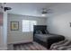 Cozy bedroom with a ceiling fan and a comfortable bed at 4187 N 298Th Ln, Buckeye, AZ 85396