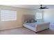 Spacious bedroom features a bed, carpet, and large windows at 4187 N 298Th Ln, Buckeye, AZ 85396