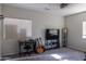 Carpeted bedroom area with a ceiling fan, TV, and desk at 4187 N 298Th Ln, Buckeye, AZ 85396