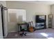 Bright bedroom with a large window, workspace, and entertainment area for a modern lifestyle at 4187 N 298Th Ln, Buckeye, AZ 85396