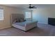 Spacious bedroom features a bed, carpet, and large windows at 4187 N 298Th Ln, Buckeye, AZ 85396