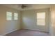 Spacious bedroom with plenty of natural light from multiple windows for a bright and airy feel at 4187 N 298Th Ln, Buckeye, AZ 85396