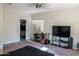 Bedroom featuring a ceiling fan, closet, study desk, entertainment center, and neutral paint at 4187 N 298Th Ln, Buckeye, AZ 85396
