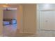 Hallway view into a spacious living room, highlighting the home's open and flowing layout at 4187 N 298Th Ln, Buckeye, AZ 85396