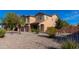 Attractive desert landscaping surrounds the front yard of this two-story home at 4187 N 298Th Ln, Buckeye, AZ 85396