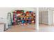 Well-organized garage with storage shelving and a garage door for secure parking and storage at 4187 N 298Th Ln, Buckeye, AZ 85396