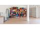 Well-organized garage with storage shelving and a garage door for secure parking and storage at 4187 N 298Th Ln, Buckeye, AZ 85396