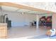Spacious garage featuring durable flooring, ample storage space, and a door for easy access at 4187 N 298Th Ln, Buckeye, AZ 85396