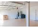 Garage interior featuring durable flooring, ample storage space, and a door for easy access at 4187 N 298Th Ln, Buckeye, AZ 85396