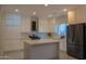 Open-concept kitchen with white cabinets, stainless steel appliances, and a large island perfect for entertaining at 4187 N 298Th Ln, Buckeye, AZ 85396