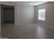 Large open living room with tile flooring, window and lots of natural light at 4187 N 298Th Ln, Buckeye, AZ 85396