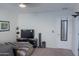 Cozy living room space featuring a TV, a beanbag chair, and comfortable furnishings at 4187 N 298Th Ln, Buckeye, AZ 85396