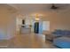 Open floor plan featuring a spacious living room and well-equipped kitchen, perfect for modern living at 4187 N 298Th Ln, Buckeye, AZ 85396