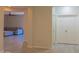 Open-concept living room with tile flooring and a comfortable sectional sofa at 4187 N 298Th Ln, Buckeye, AZ 85396
