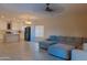 Comfortable living room adjacent to a modern kitchen, offering a seamless and inviting living experience at 4187 N 298Th Ln, Buckeye, AZ 85396