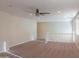 Large loft area with carpet flooring and plenty of natural light at 4187 N 298Th Ln, Buckeye, AZ 85396