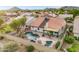 Aerial view of the backyard showcasing the custom pool, covered patio, and well-maintained landscaping at 4329 W Electra Ln, Glendale, AZ 85310