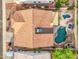 Overhead view of the backyard, featuring a unique pool, covered patio, desert landscaping, and privacy fencing at 4329 W Electra Ln, Glendale, AZ 85310