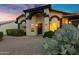 Front exterior view of home with desert landscaping, including cactus at 4329 W Electra Ln, Glendale, AZ 85310