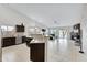 Open floor plan with kitchen, living room, and fireplace, great for entertaining at 4329 W Electra Ln, Glendale, AZ 85310