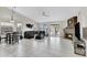 Large living room with fireplace, tile floors, and plenty of natural light at 4329 W Electra Ln, Glendale, AZ 85310