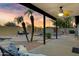 Relaxing covered patio overlooking the pool area, perfect for outdoor entertaining and lounging at 4329 W Electra Ln, Glendale, AZ 85310