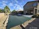Spacious backyard featuring a covered pool, desert landscaping and a covered patio at 43455 W Chisholm Dr, Maricopa, AZ 85138