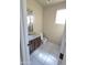 Powder room with modern vanity, granite countertop, and a neutral color scheme at 43455 W Chisholm Dr, Maricopa, AZ 85138