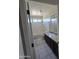 Bright bathroom with a shower-tub combo featuring sleek tile and a dark wood vanity with granite countertops at 43455 W Chisholm Dr, Maricopa, AZ 85138