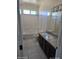 Bathroom featuring a shower and bath tub combination, tiled floor, and vanity at 43455 W Chisholm Dr, Maricopa, AZ 85138