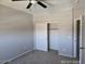 Simple bedroom featuring neutral paint, carpet floors, and closet with sliding doors at 43455 W Chisholm Dr, Maricopa, AZ 85138