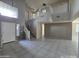 Spacious foyer featuring a grand staircase, tile floors, and high ceilings at 43455 W Chisholm Dr, Maricopa, AZ 85138
