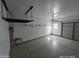 Clean, spacious garage with built-in storage racks and ample room for vehicles at 43455 W Chisholm Dr, Maricopa, AZ 85138