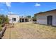 Spacious backyard featuring covered patio, grass and a detached garage at 439 N Cherry --, Mesa, AZ 85201