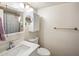 Bathroom featuring a white vanity, mirror, toilet and a shower with a patterned curtain at 439 N Cherry --, Mesa, AZ 85201