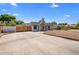 Charming single-story home featuring an expansive driveway and distinctive architectural details at 439 N Cherry --, Mesa, AZ 85201