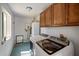 Well-lit laundry room featuring new washer and dryer units, cabinets and bright floors at 439 N Cherry --, Mesa, AZ 85201