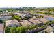 This is an aerial view of a neighborhood full of tile-roofed homes with mature landscaping and beautiful surroundings at 4519 N 29Th Way, Phoenix, AZ 85016