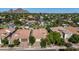 An aerial view showcasing a desert neighborhood with lush landscaping and a backdrop of scenic mountains at 4519 N 29Th Way, Phoenix, AZ 85016