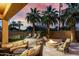 Relaxing backyard with fire pit, lounge chairs, and lush tropical landscaping at 4519 N 29Th Way, Phoenix, AZ 85016