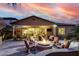 Beautiful backyard with a cozy fire pit, comfortable seating, and outdoor dining area at 4519 N 29Th Way, Phoenix, AZ 85016