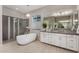 Bright bathroom features a modern soaking tub and glass shower, plus vanity at 4519 N 29Th Way, Phoenix, AZ 85016