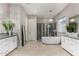 Luxury bathroom with soaking tub, standing shower, dual vanities, neutral paint, and modern fixtures at 4519 N 29Th Way, Phoenix, AZ 85016
