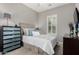 Neutral bedroom features stylish accents and window with plantation shutters at 4519 N 29Th Way, Phoenix, AZ 85016