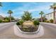 A view of the community entrance displaying the neighborhood name, manicured landscape, and desert flora at 4519 N 29Th Way, Phoenix, AZ 85016